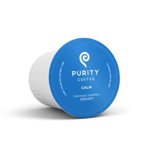 A blue cup of coffee with the word purity on it.
