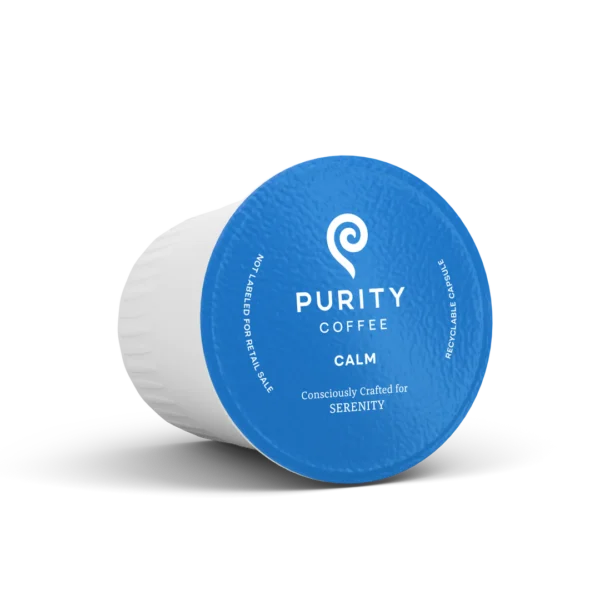 A blue cup of coffee with the word purity on it.